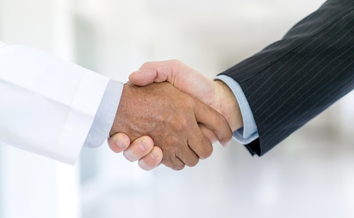 Partners shaking hands in business.